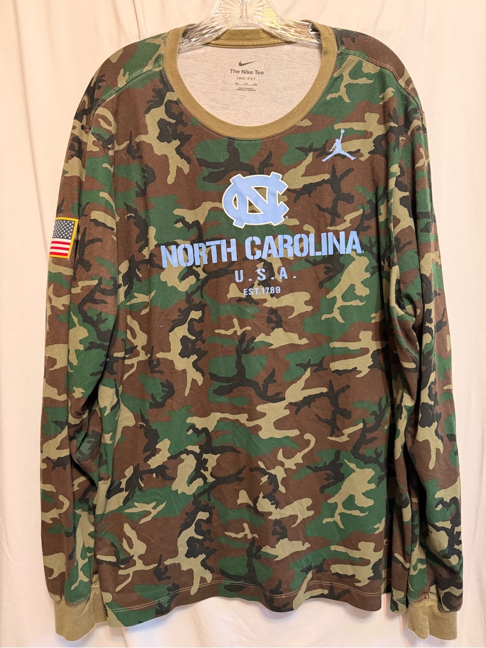 Jordan men’s Long-Sleeve Camo Tee with Carolina Blue Logo in a XXL.